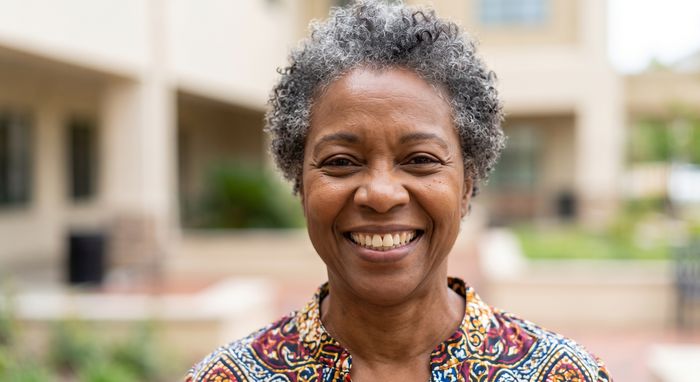 Smiling mature African woman patient